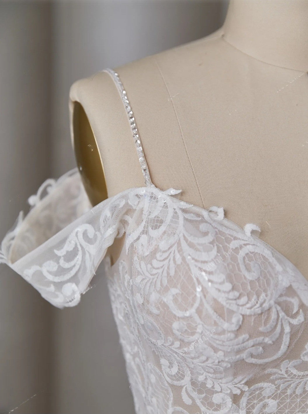 Lace dress on a mannequin with a neutral background