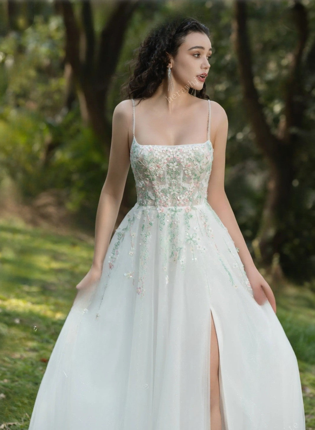 Woman wearing a floral dress with a blurred natural background