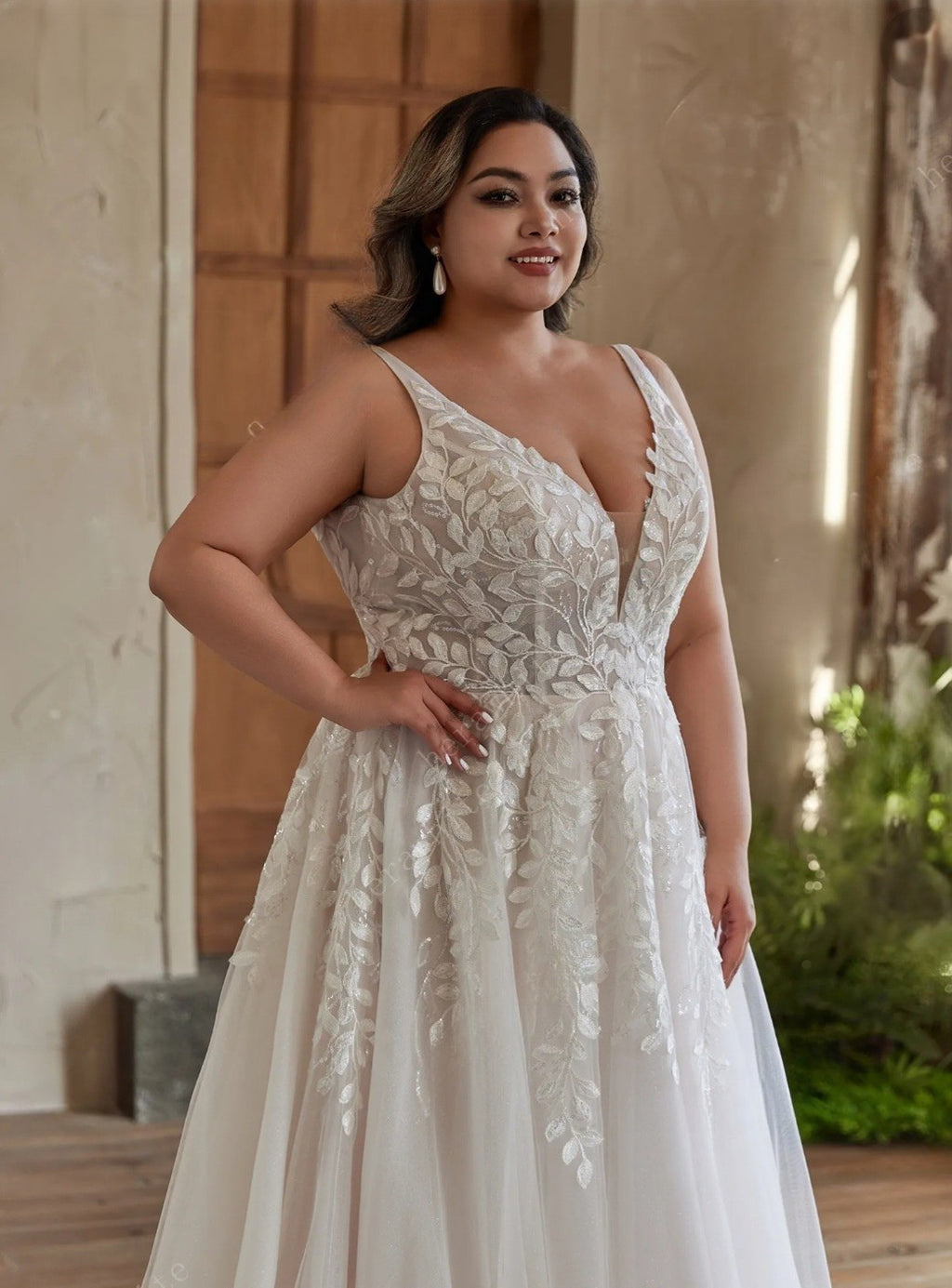 Woman wearing a white lace wedding dress in an outdoor setting.