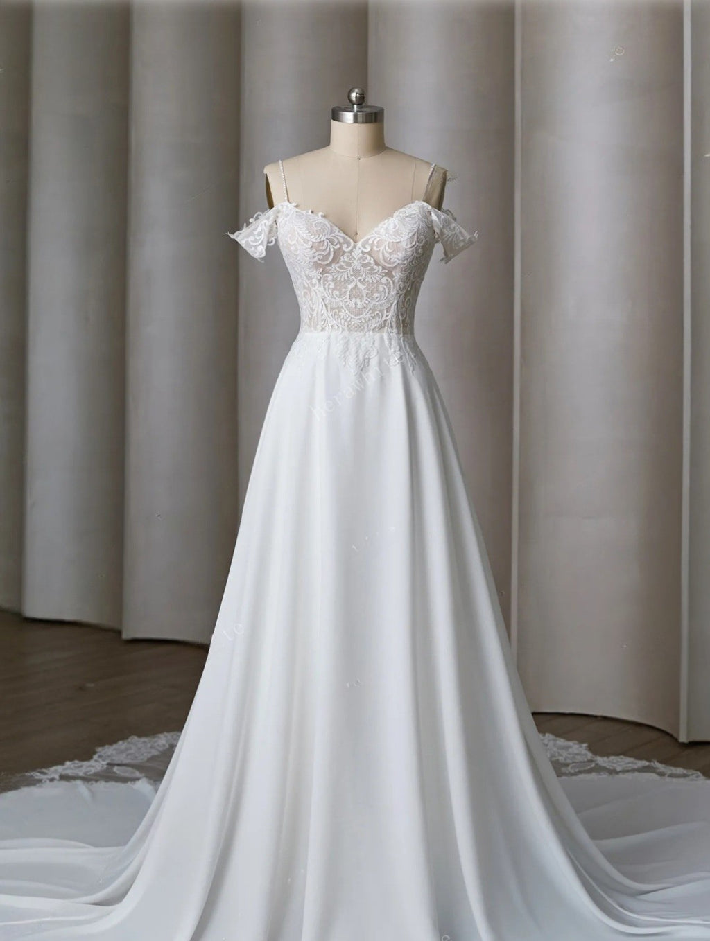 White wedding dress on a mannequin against a neutral background