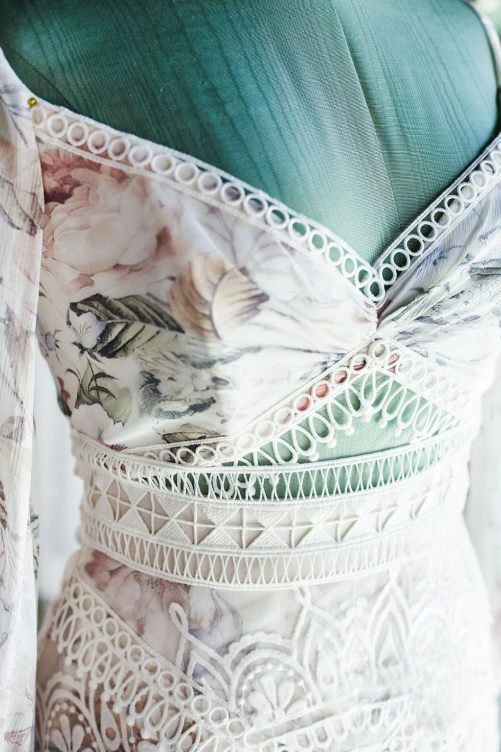 Close-up of a floral-patterned garment with lace details