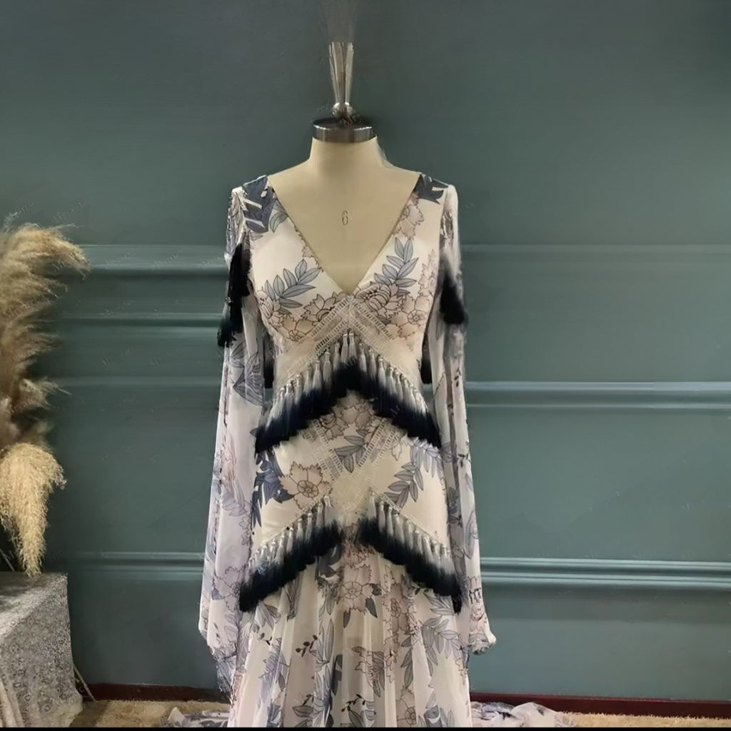 Floral dress on a mannequin against a green wall